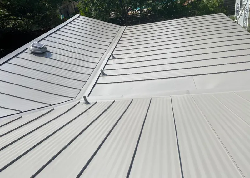 Solar attic fan installed on a metal roof for Roof Ventilation in Satellite Beach